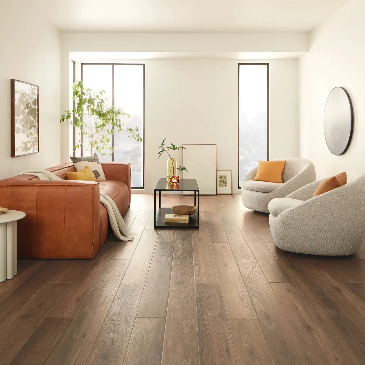 VV735_03018_ROOM COREtec Luxury Vinyl in a dark brown wood tone in a bright living room | Ambassador Flooring