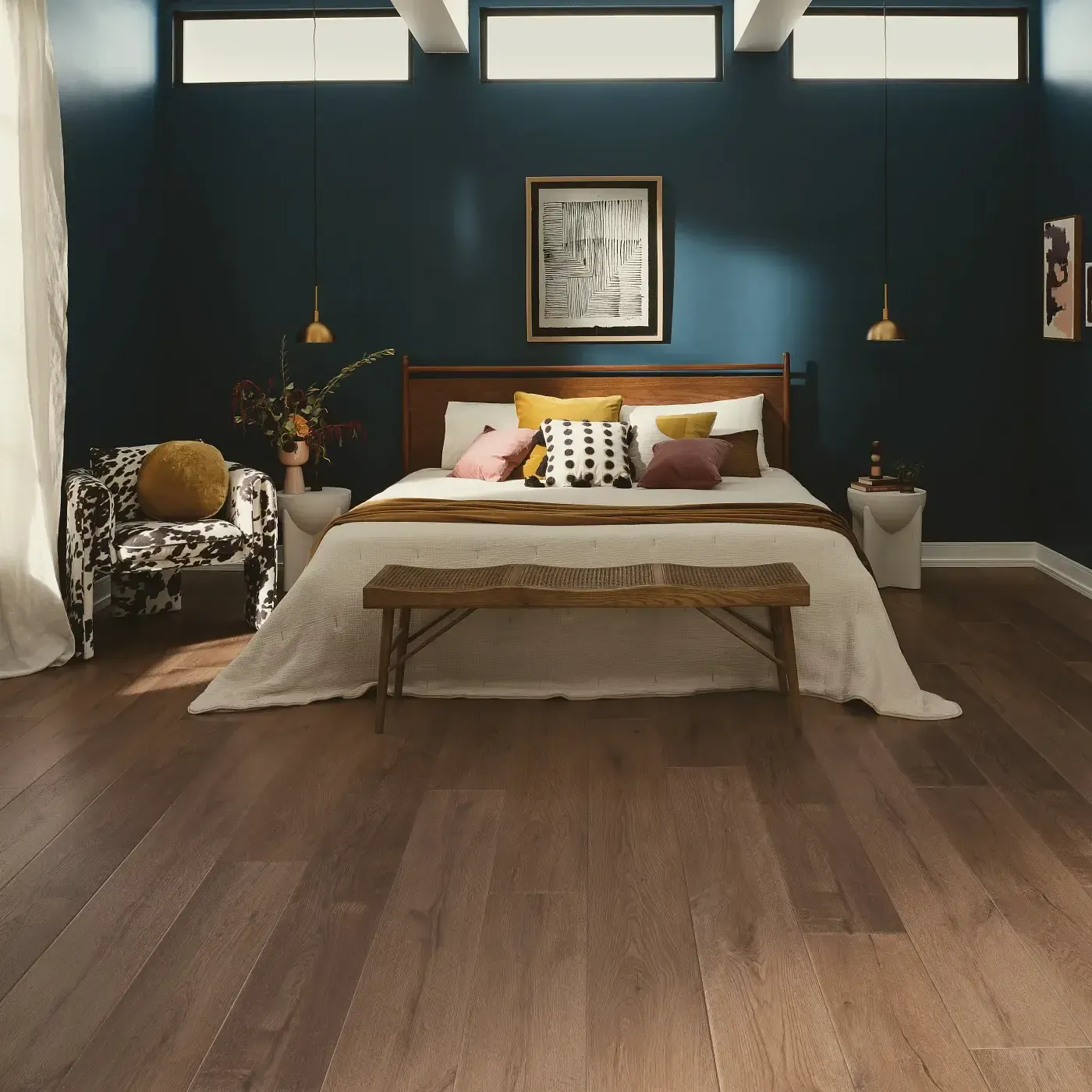 VV810_04027_ROOM COREtec Luxury Vinyl in a medium brown wood tone in a bedroom | Ambassador Flooring